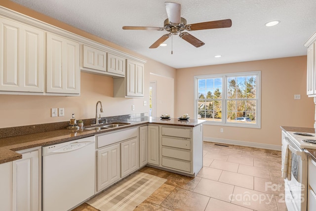 kitchen with white appliances, kitchen peninsula, light tile patterned floors, ceiling fan, and sink