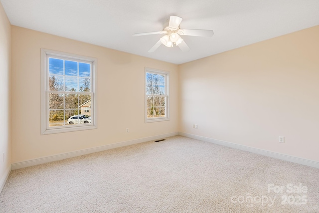 empty room with carpet flooring and ceiling fan