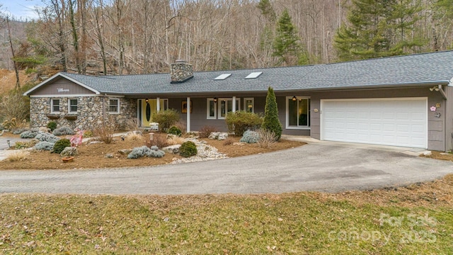 ranch-style house featuring a garage