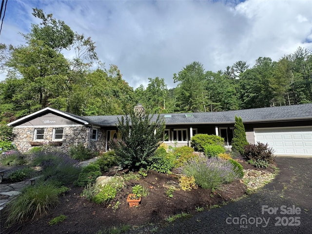 53 Jump Cove Rd, Weaverville, NC 28787 - single story home with an attached garage, stone siding, driveway, and a chimney