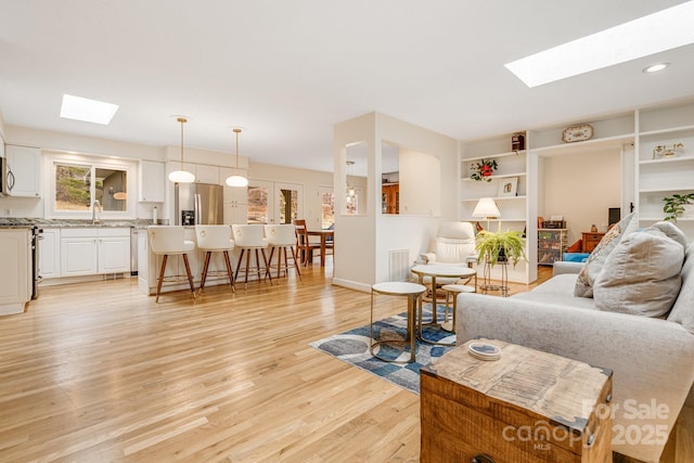 53 Jump Cove Rd, Weaverville, NC 28787 - living room with a skylight, light wood-style floors, and recessed lighting