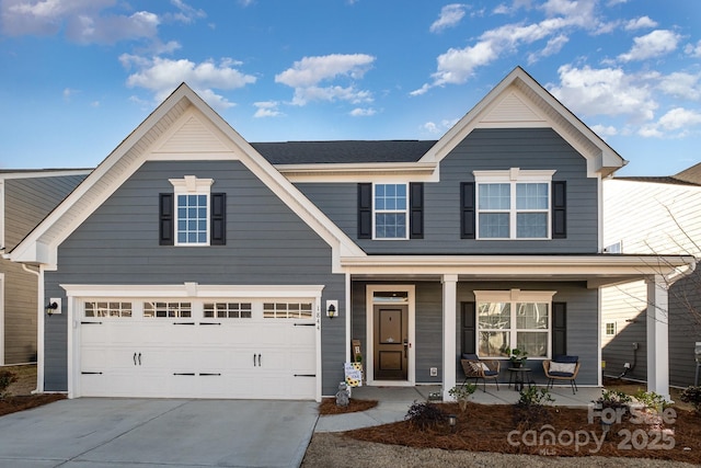 view of front of property featuring covered porch and a garage