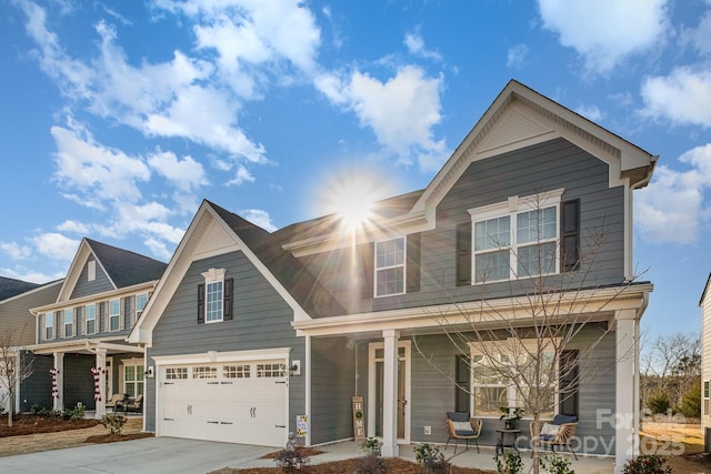 view of front of home with a porch and a garage