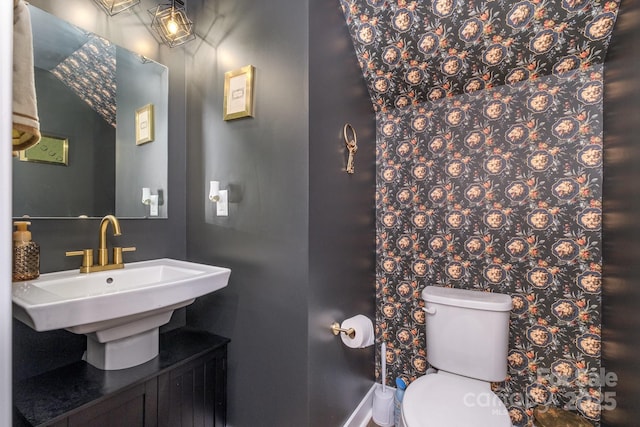 bathroom with toilet and sink