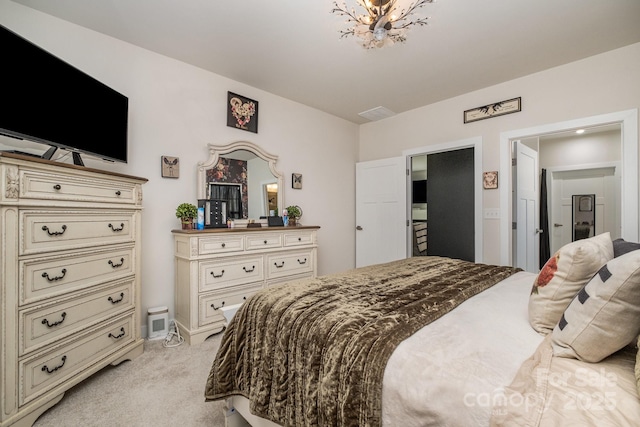 bedroom with light colored carpet