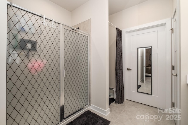 bathroom with tile patterned flooring and walk in shower