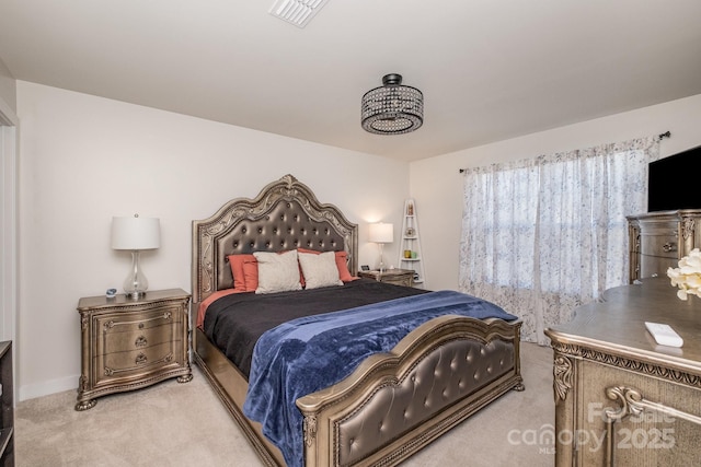 bedroom featuring light colored carpet