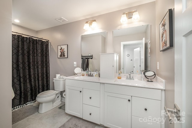 bathroom featuring a shower with curtain, vanity, and toilet