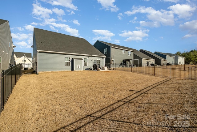 back of house with a yard