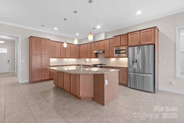 kitchen with appliances with stainless steel finishes, brown cabinetry, and decorative light fixtures