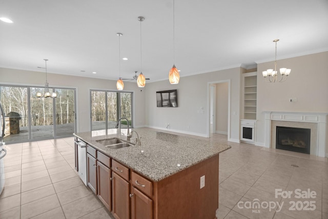 kitchen with an inviting chandelier, a sink, and decorative light fixtures