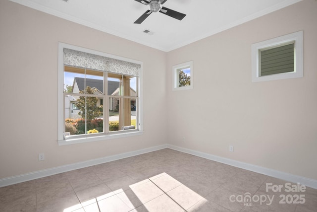 unfurnished room with crown molding, ceiling fan, visible vents, and baseboards