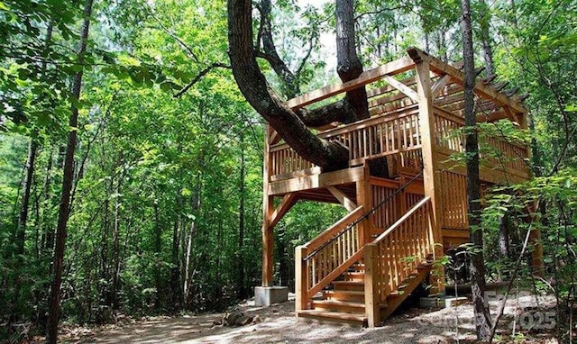 view of play area featuring a view of trees