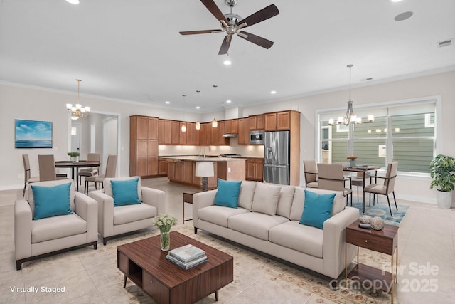 living room featuring light tile patterned floors, ornamental molding, ceiling fan with notable chandelier, and recessed lighting