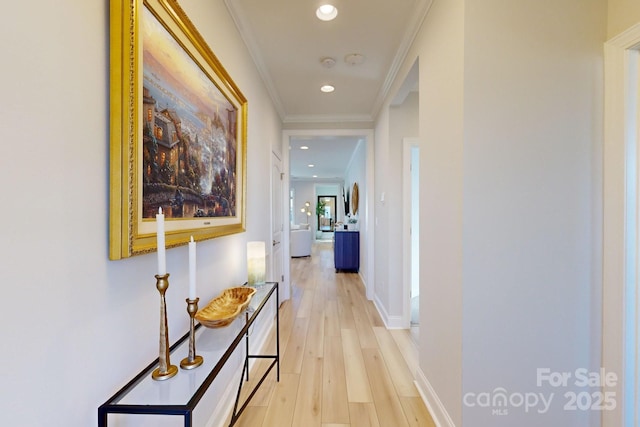 hallway with crown molding and light wood-type flooring