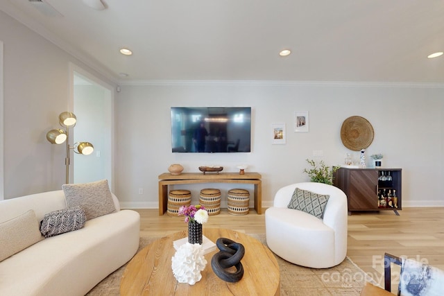 living room featuring hardwood / wood-style floors and ornamental molding