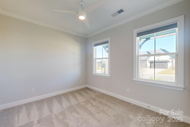 empty room with ceiling fan, light carpet, and ornamental molding