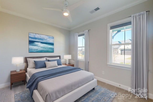 bedroom with ceiling fan and crown molding