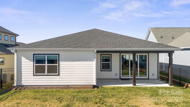 back of house featuring a yard and a patio