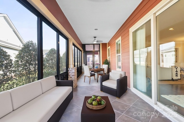 sunroom / solarium with ceiling fan