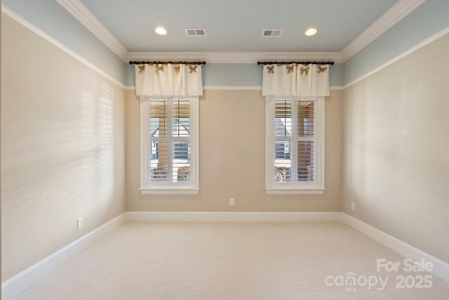 unfurnished room featuring ornamental molding and carpet