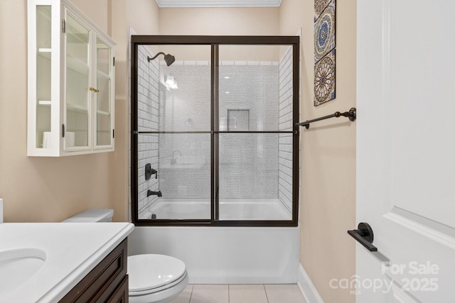 full bathroom featuring tile patterned flooring, vanity, bath / shower combo with glass door, and toilet