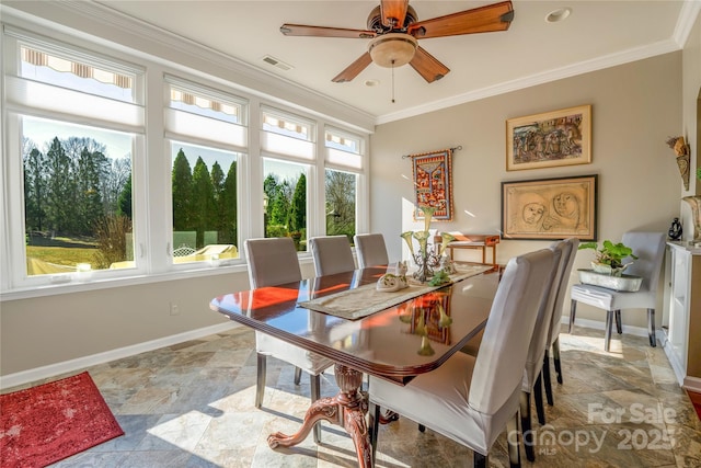 dining room featuring ceiling fan and crown molding