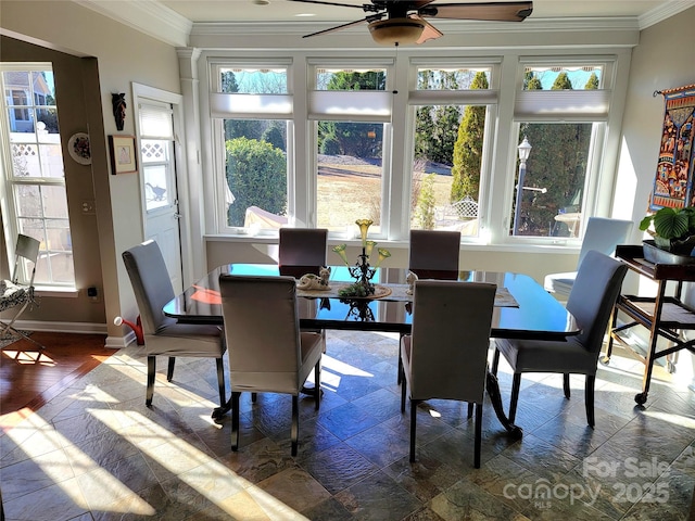 sunroom / solarium featuring ceiling fan and a wealth of natural light