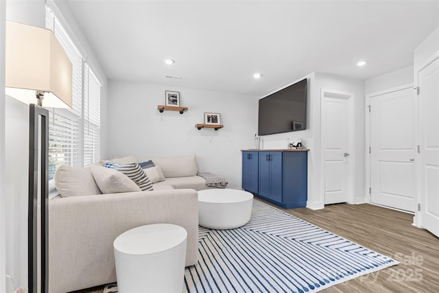 living room with hardwood / wood-style flooring