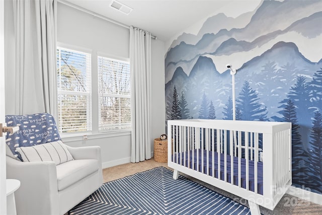 bedroom featuring carpet floors and a nursery area