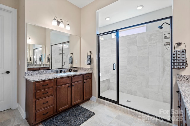 bathroom featuring vanity and an enclosed shower