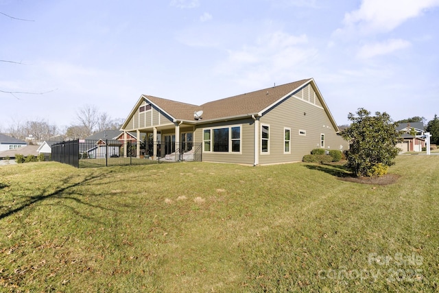 back of house with a yard