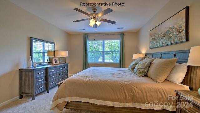 carpeted bedroom with ceiling fan