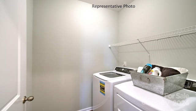 laundry area featuring washing machine and clothes dryer