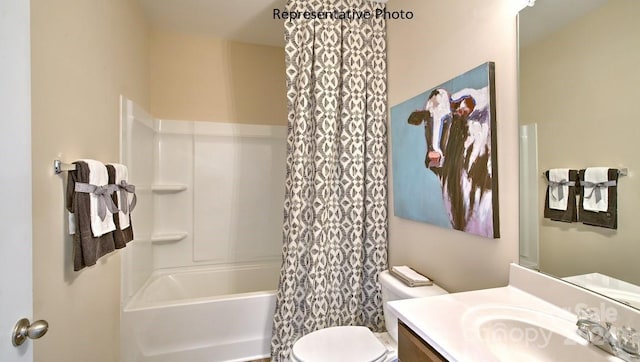 full bathroom featuring shower / bath combo, vanity, and toilet