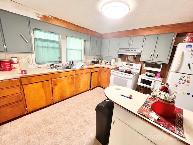 kitchen featuring sink and white appliances