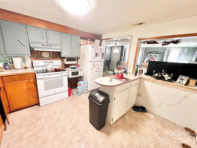 kitchen with white appliances and gray cabinets