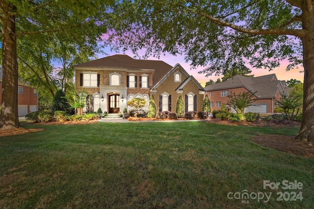 view of front of house with a lawn