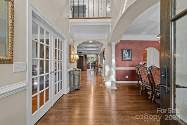 entrance foyer with french doors, decorative columns, hardwood / wood-style flooring, and coffered ceiling