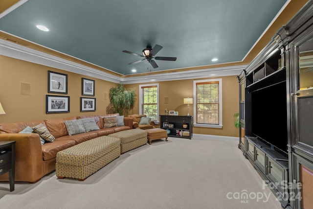 carpeted living room featuring ceiling fan and ornamental molding