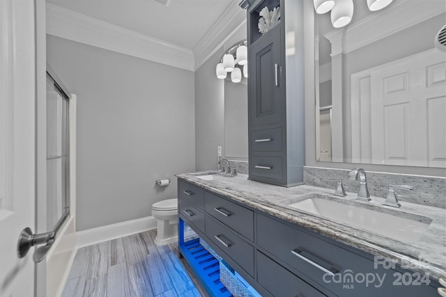 bathroom featuring vanity, toilet, and crown molding