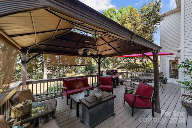 deck with a gazebo, an outdoor hangout area, and area for grilling