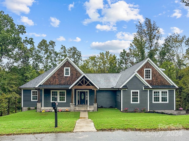 craftsman house with a front lawn