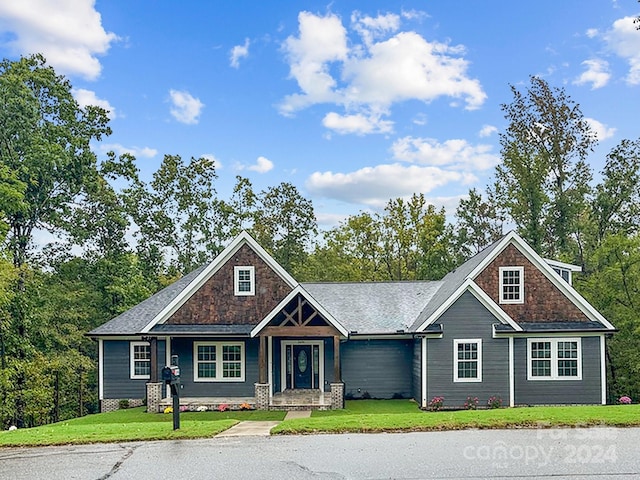 craftsman-style home with a front lawn