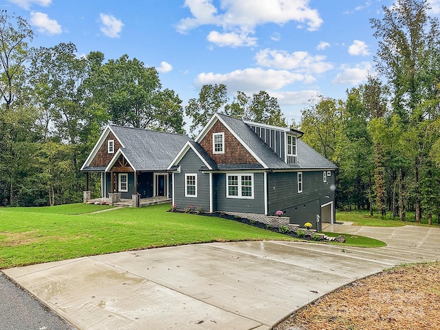 view of front of property with a front lawn and a garage