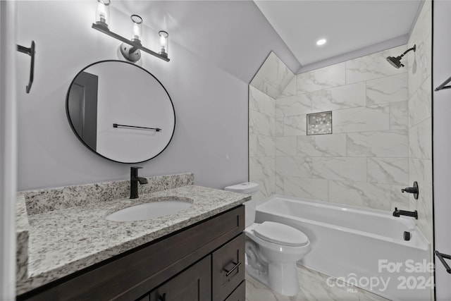 full bathroom featuring tiled shower / bath combo, toilet, and vanity