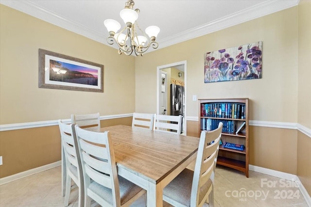 dining space featuring a notable chandelier, light tile patterned floors, and crown molding