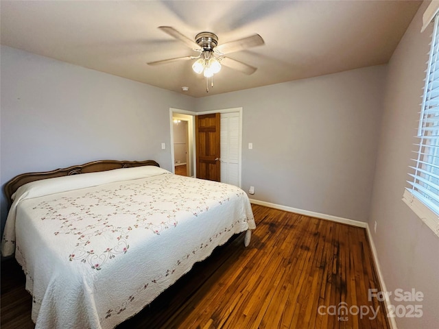 bedroom featuring ceiling fan, baseboards, dark wood finished floors, and a closet