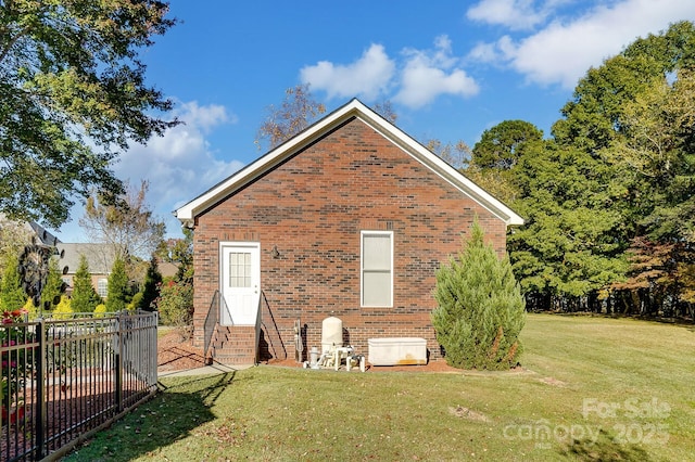 back of house with a yard