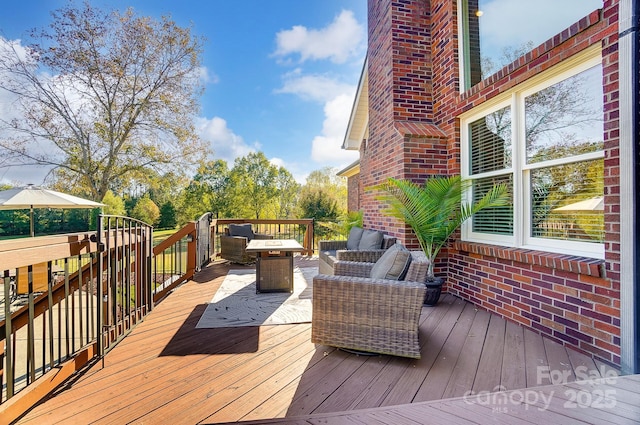 wooden terrace with outdoor lounge area